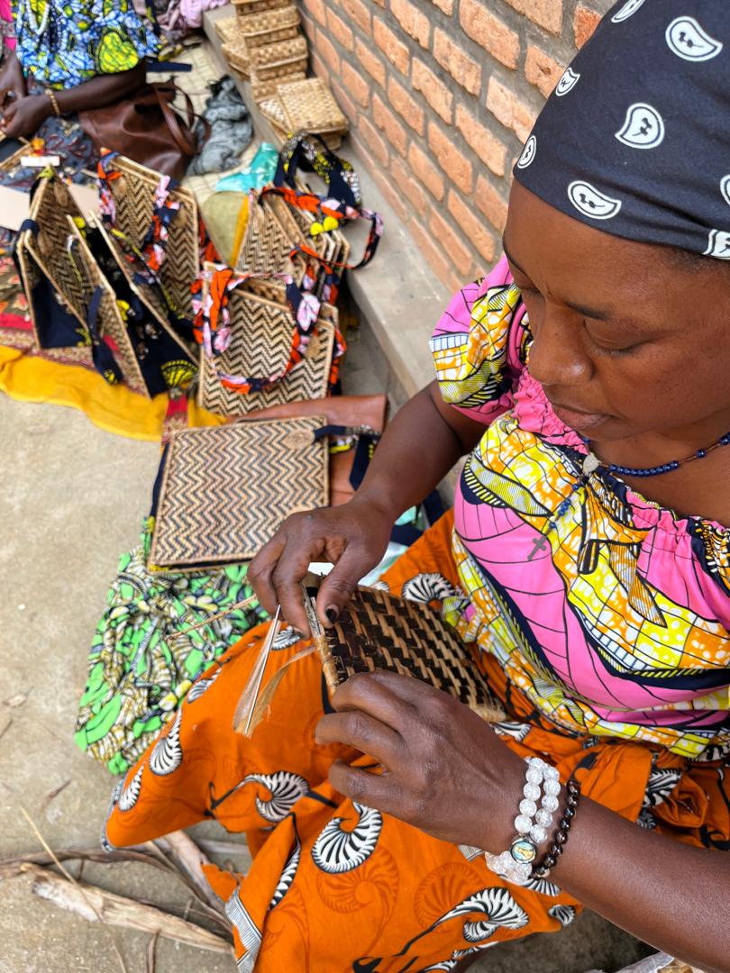 Artisan working on Banana Panel Pop Up Tote in Rwanda